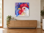Blue Fence Rooster animal canvas print on the wall of a living room above a sideboard