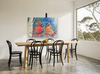 Cardinal Pair in Snowfall animal canvas print on the wall of a dining room