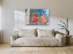 Cardinal Pair in Snowfall animal canvas print on the wall of a living room