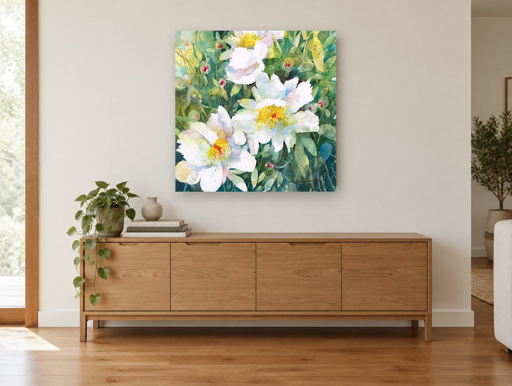 White Blooms in Green floral canvas print on the wall of a living room above a sideboard