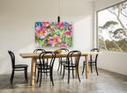 Pink Garden Chorus floral canvas print on the wall of a dining room