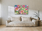 Pink Garden Chorus floral canvas print on the wall of a living room