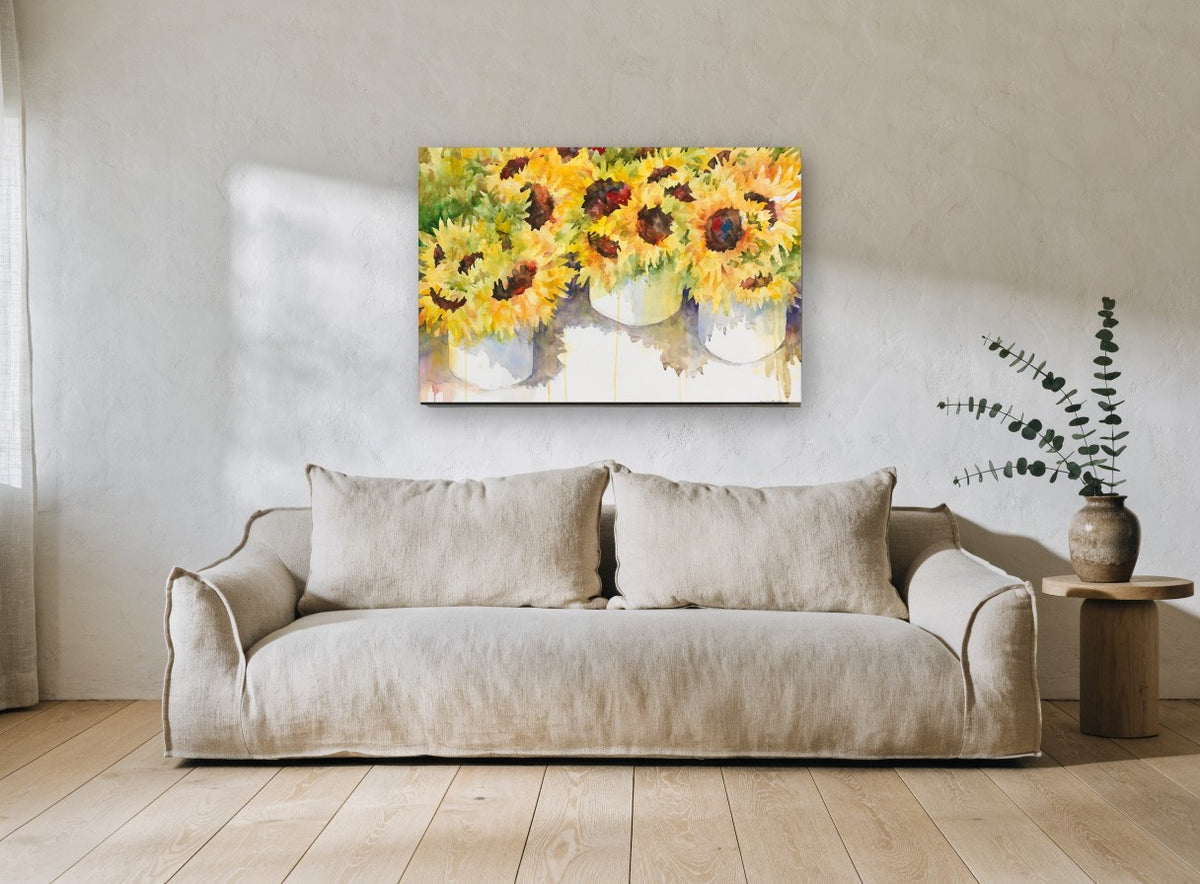 Sunflower Buckets floral canvas print on the wall of a living room