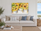 Sunflower Buckets floral canvas print on the wall of a beach house living room
