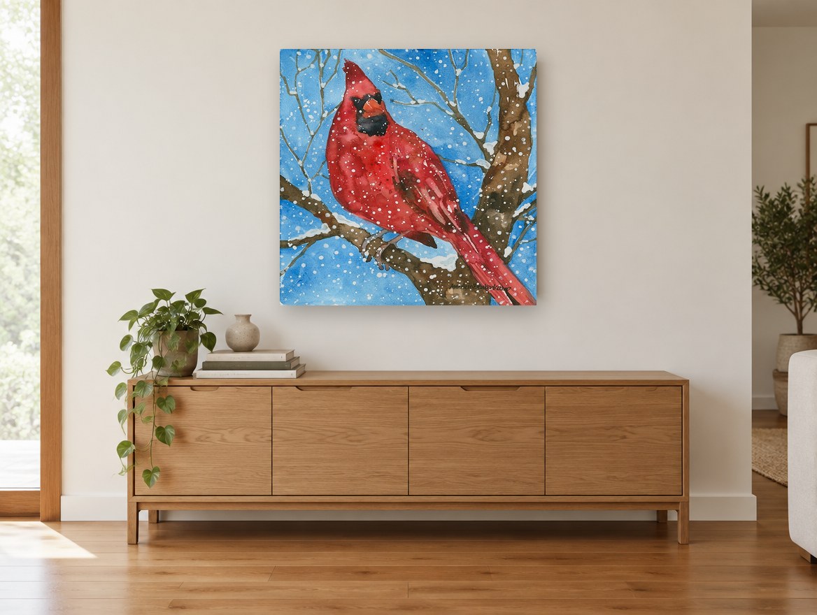 Cardinal in Falling Snow animal canvas print on the wall of a living room above a sideboard