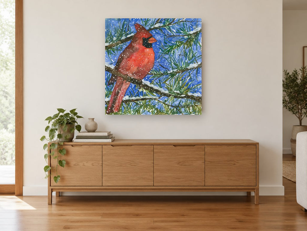 Cardinal in Snowy Pine animal canvas print on the wall of a living room above a sideboard