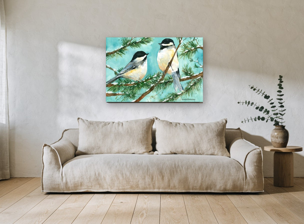 Two Chickadees in Snow landscape canvas print on the wall of a living room