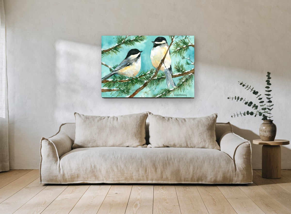 Two Chickadees in Snow landscape canvas print on the wall of a living room