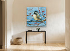 Chickadee on Snowy Branch animal canvas print on the wall of a hallway