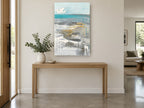Dripping Teal Shoreline coastal canvas print on the wall of a entry hall