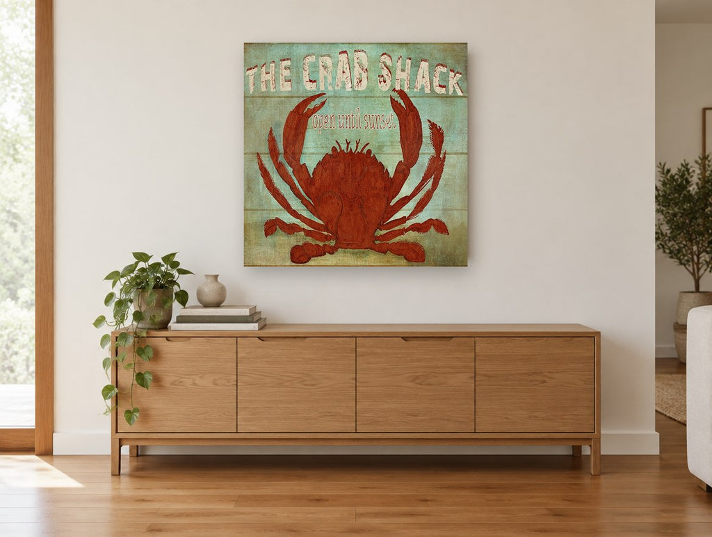 Red Crab Shack Sign coastal canvas print on the wall of a living room above a sideboard
