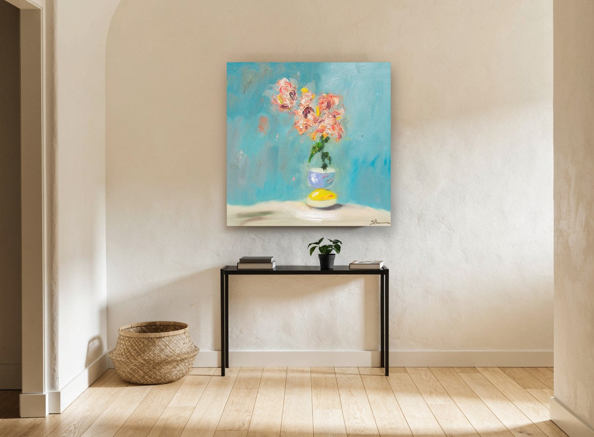 Coral Blooms on Teal floral canvas print on the wall of a hallway