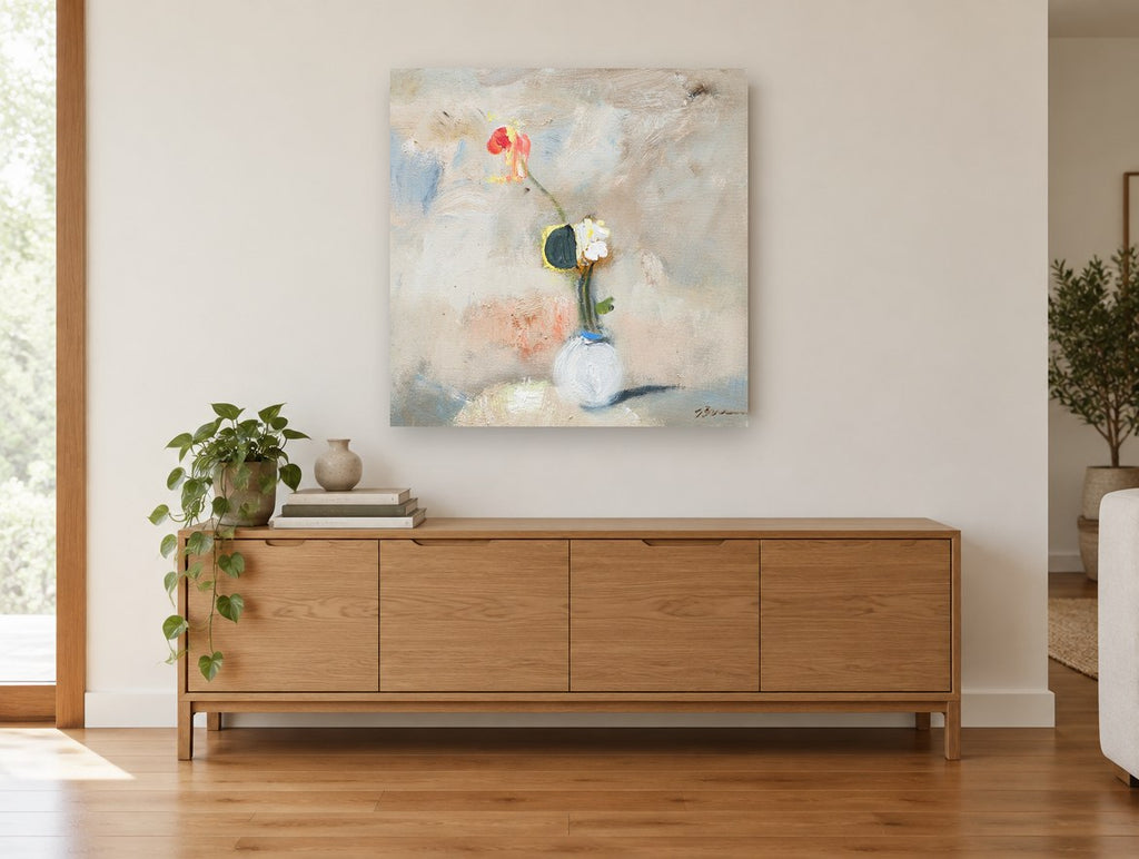 Lone Poppy in White Vase floral canvas print on the wall of a living room above a sideboard