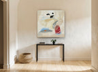 Red Vase Black Stems floral canvas print on the wall of a hallway