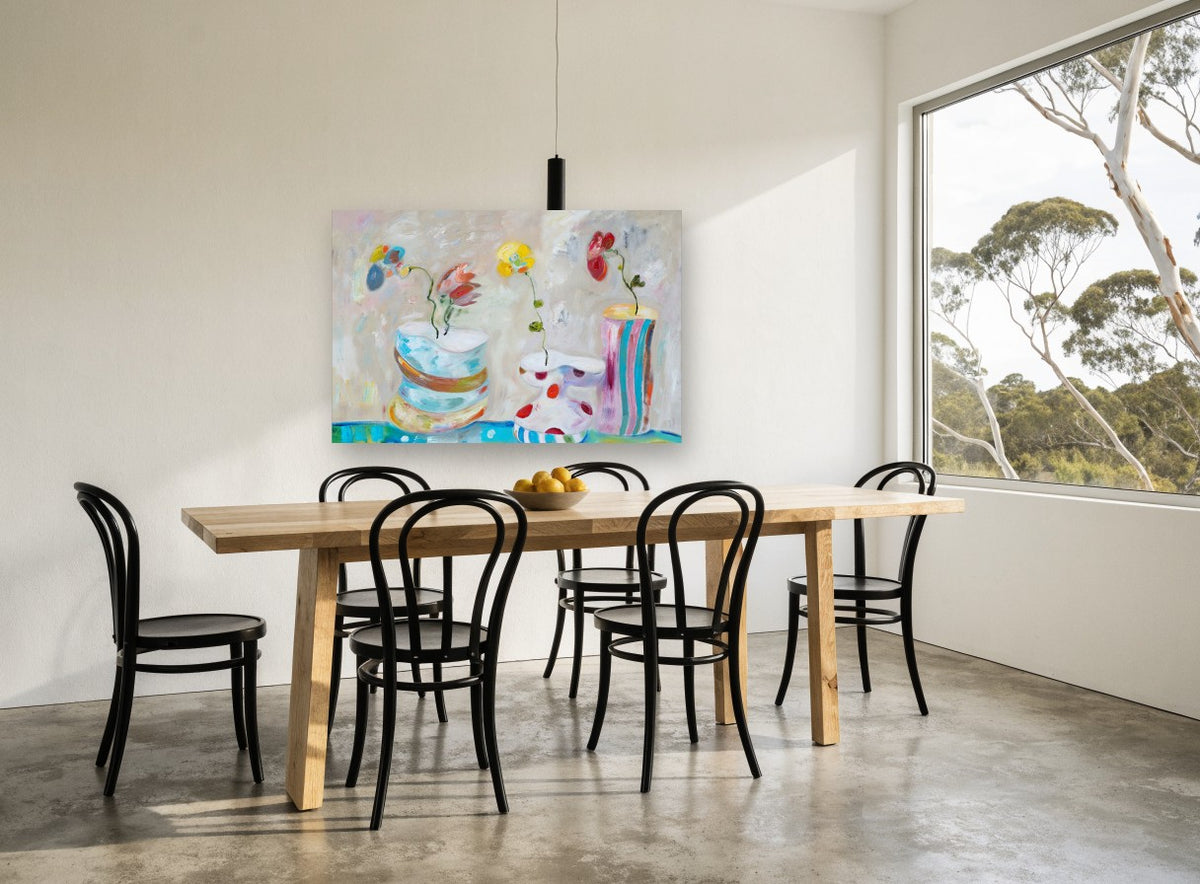 Three Playful Vases floral canvas print on the wall of a dining room