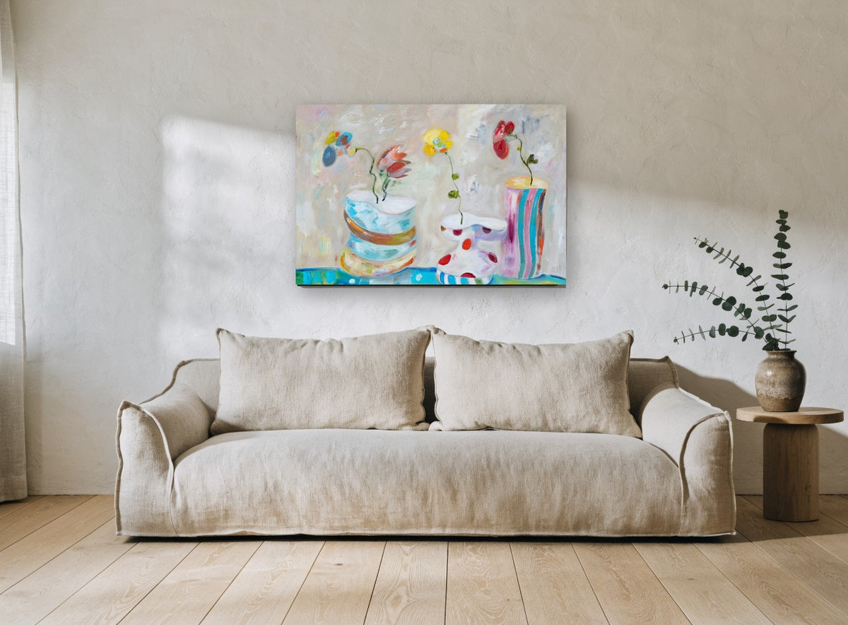 Three Playful Vases floral canvas print on the wall of a living room