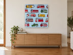 Fire Engine Parade kids canvas print on the wall of a living room above a sideboard