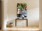 Stacked Stones Water Spout floral canvas print on the wall of a hallway