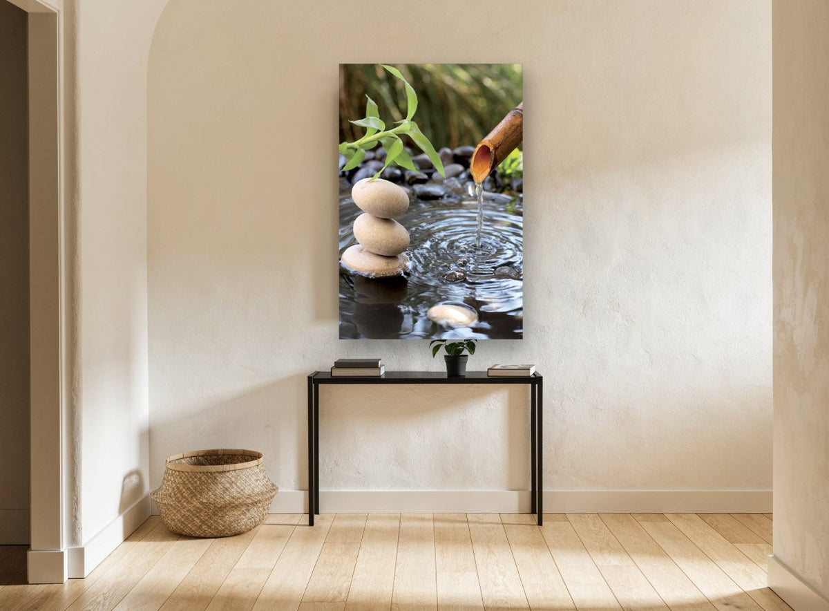 Stacked Stones Water Spout floral canvas print on the wall of a hallway