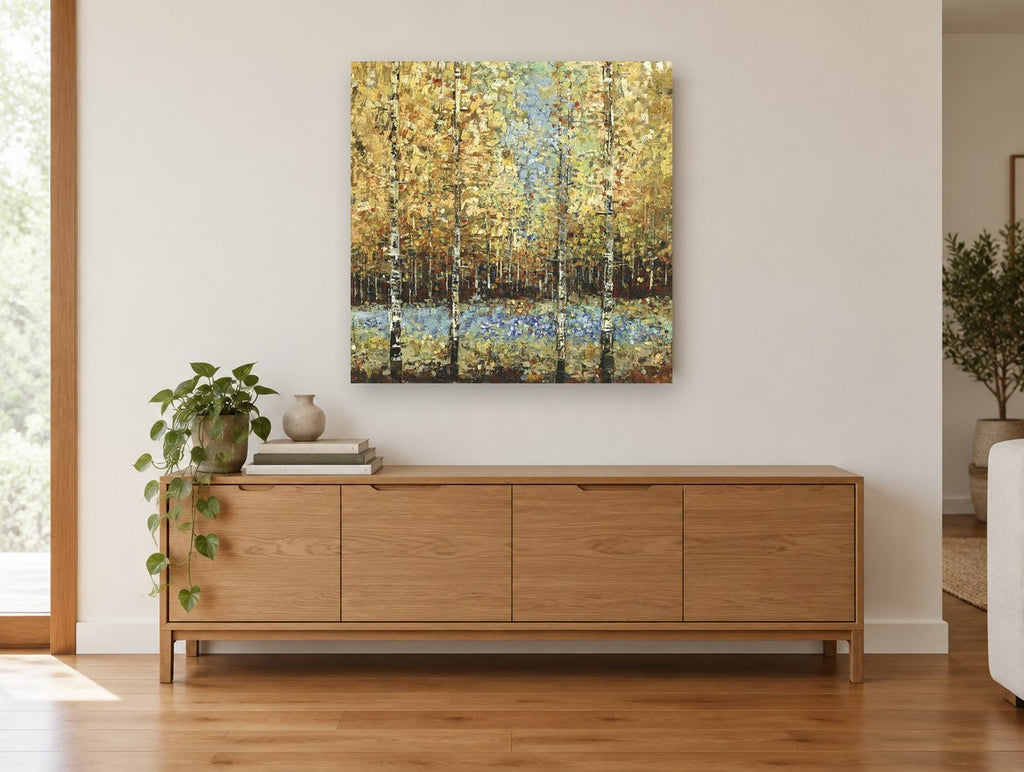 Golden Birch Clearing landscape canvas print on the wall of a living room above a sideboard