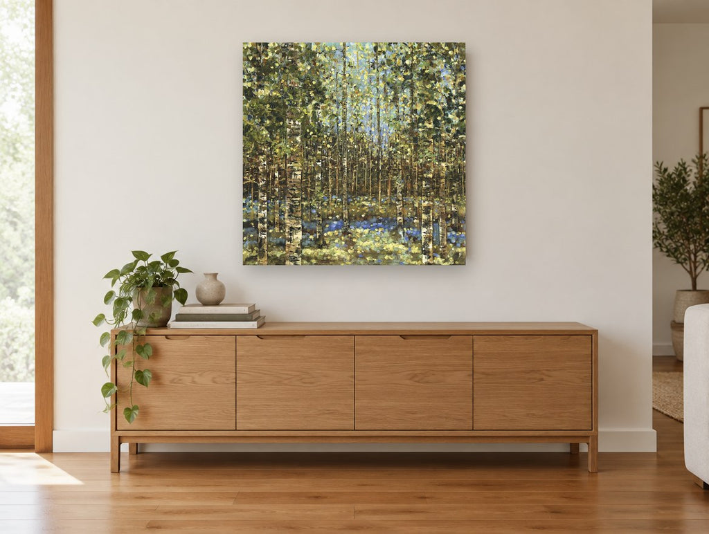 Birch Grove Bluebells landscape canvas print on the wall of a living room above a sideboard