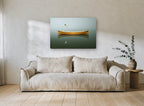 Canoe and Gull Calm coastal canvas print on the wall of a living room