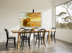 Golden Moored Dinghy coastal canvas print on the wall of a dining room