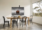 Gull Over Still Boat coastal canvas print on the wall of a dining room