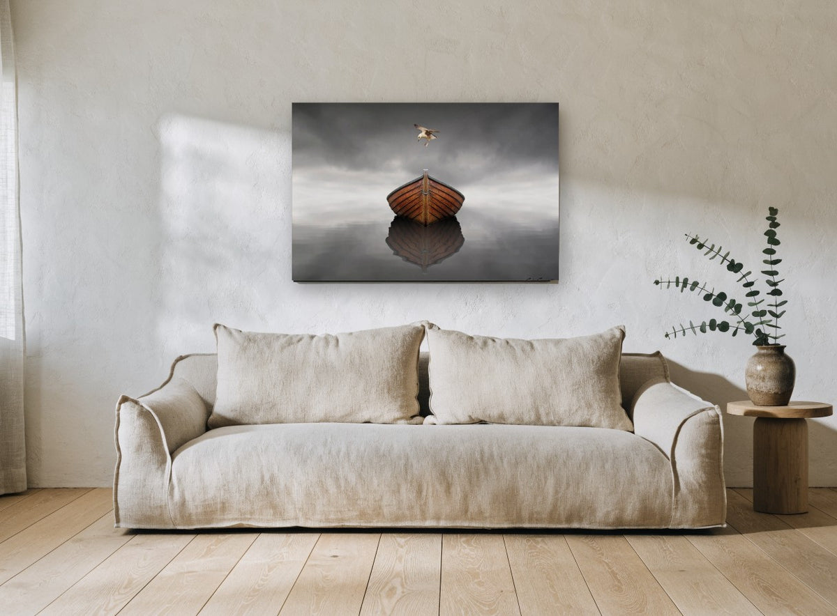 Gull Over Still Boat coastal canvas print on the wall of a living room