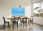 Blue Haze Moorings coastal canvas print on the wall of a dining room