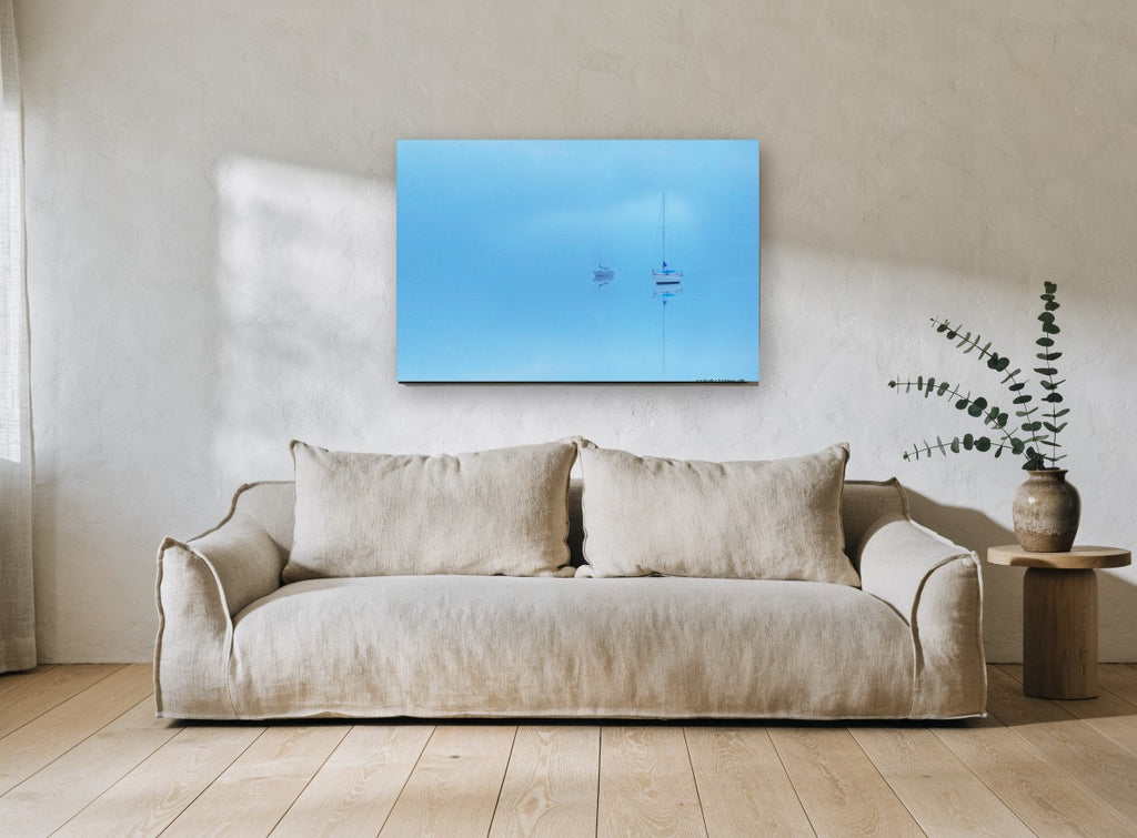 Blue Haze Moorings coastal canvas print on the wall of a living room