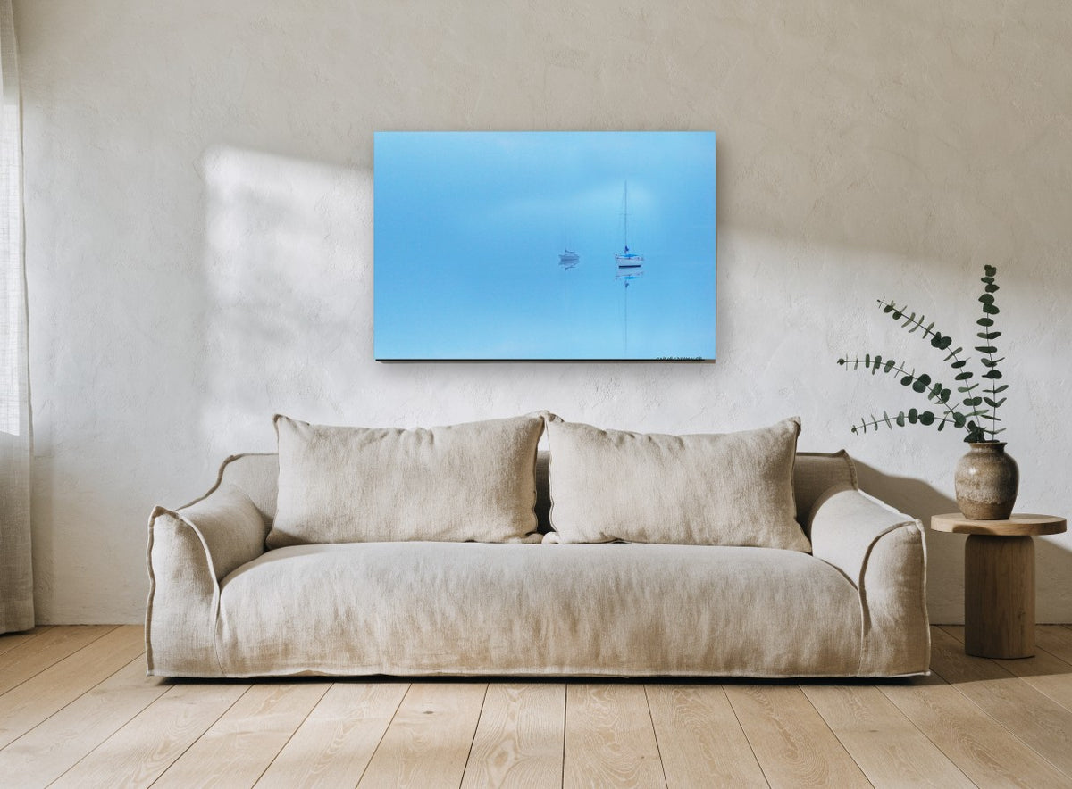 Blue Haze Moorings coastal canvas print on the wall of a living room