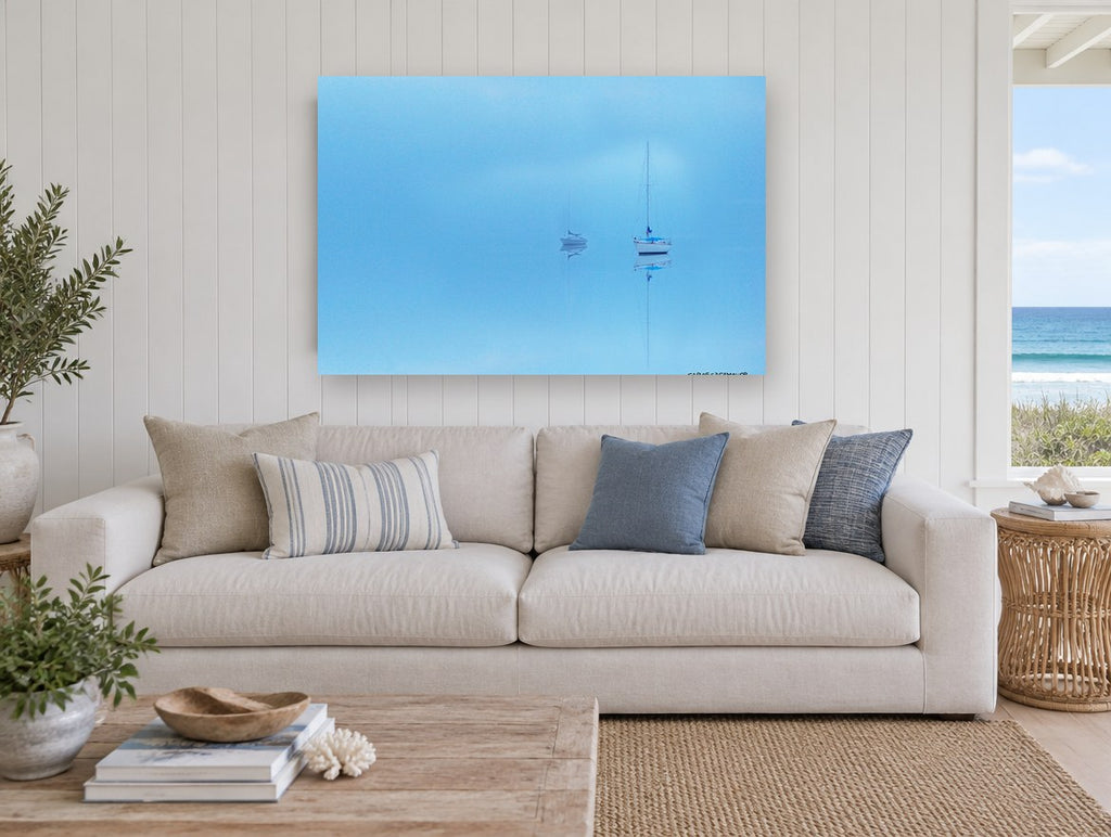 Blue Haze Moorings coastal canvas print on the wall of a beach house living room