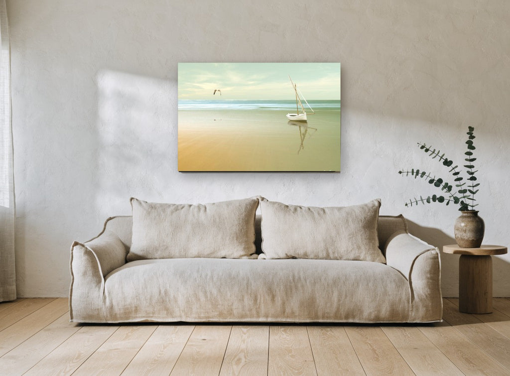 Stranded Boat at Dawn coastal canvas print on the wall of a living room