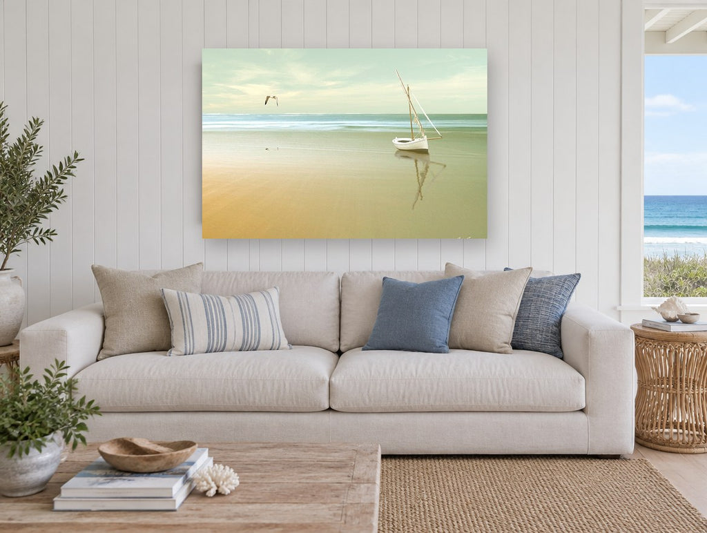 Stranded Boat at Dawn coastal canvas print on the wall of a beach house living room