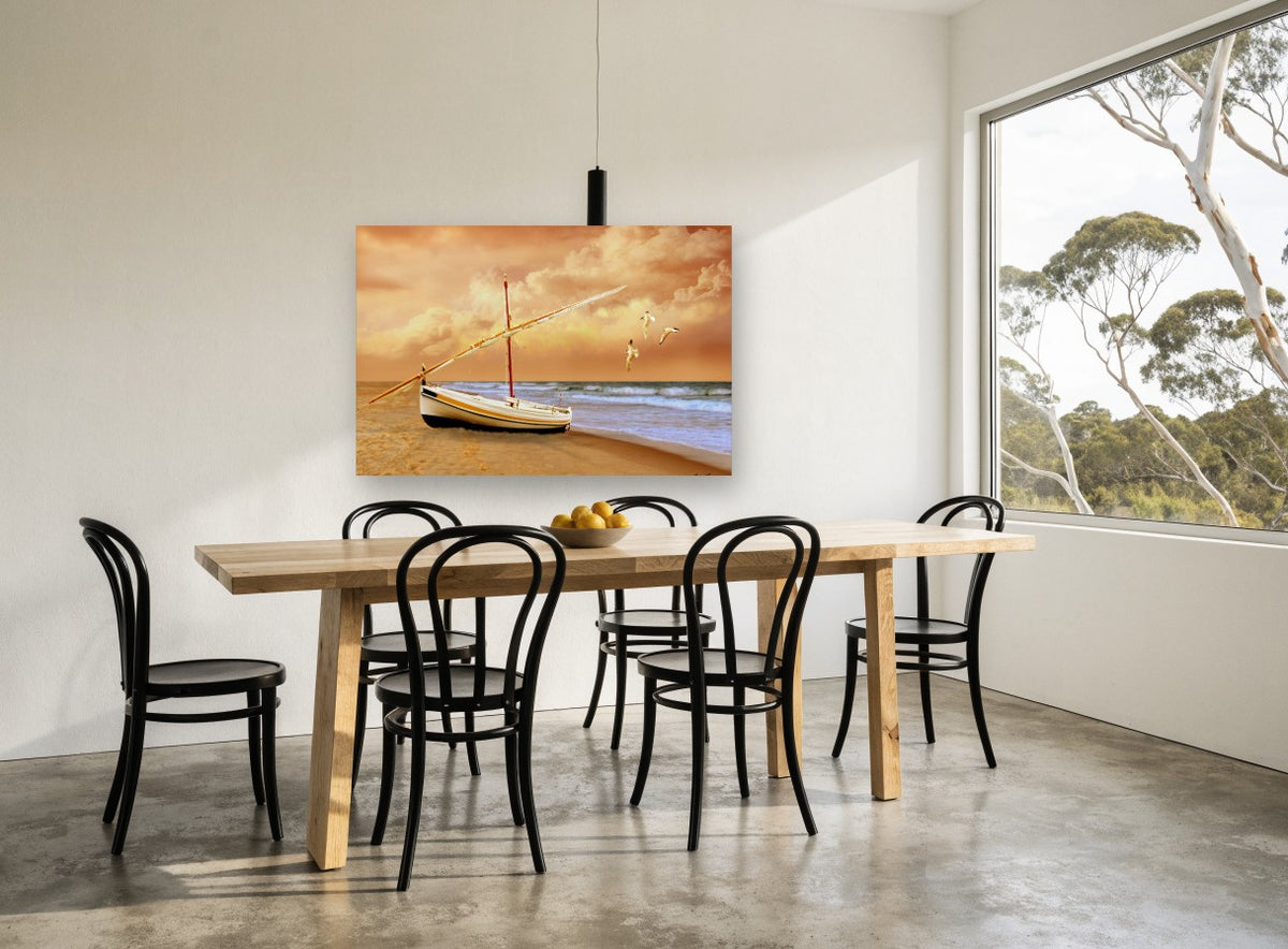 Sunrise Boat on Sand coastal canvas print on the wall of a dining room