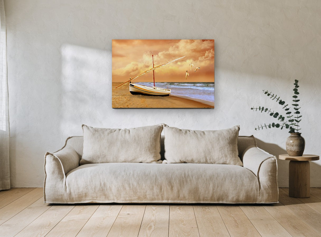 Sunrise Boat on Sand coastal canvas print on the wall of a living room