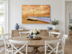 Sunrise Boat on Sand coastal canvas print on the wall of a Hamptons dining room