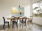 Rowboat and Gulls at Dawn coastal canvas print on the wall of a dining room