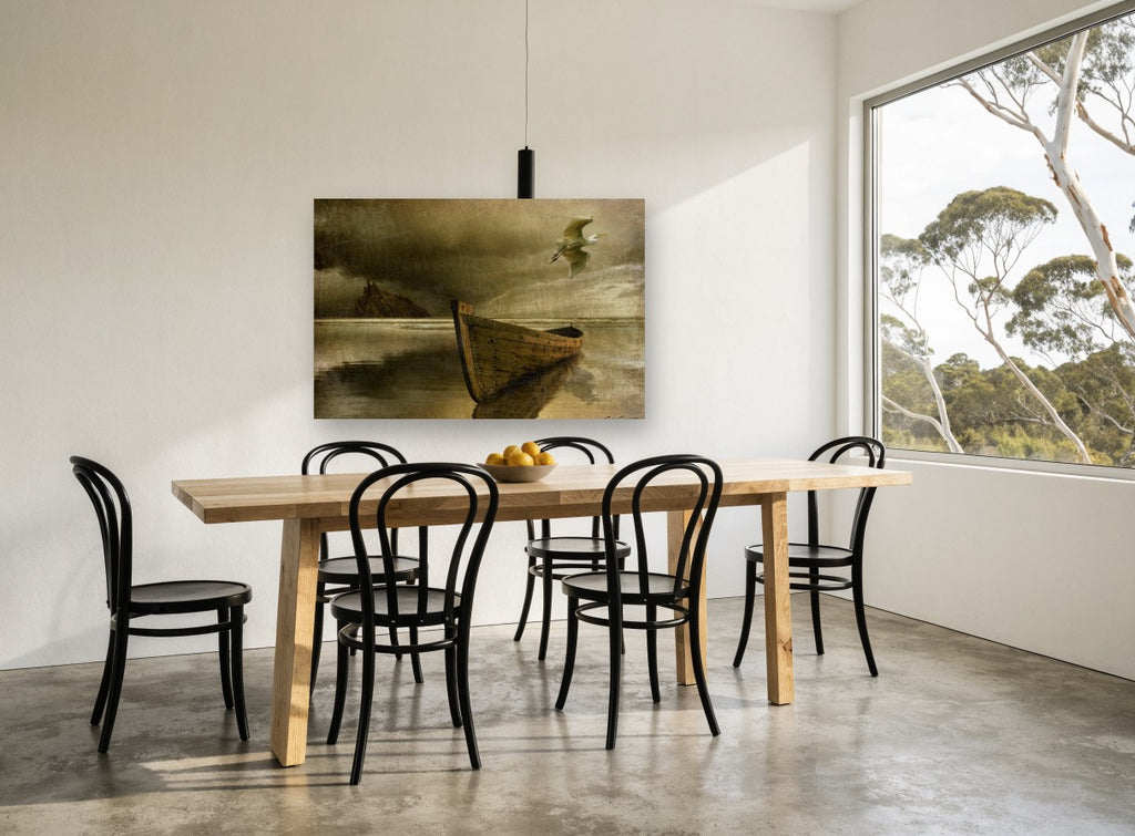 Lone Boat and Egret coastal canvas print on the wall of a dining room