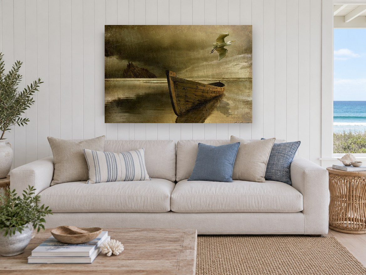 Lone Boat and Egret coastal canvas print on the wall of a beach house living room