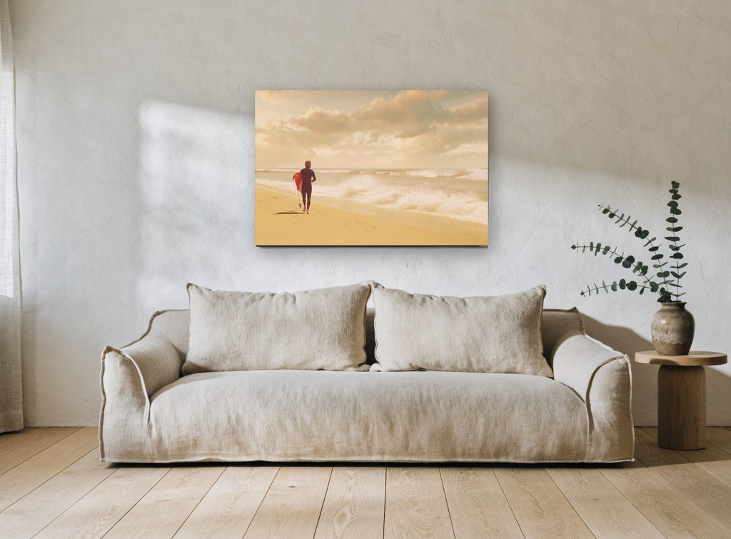 Surfer Walking the Shore coastal canvas print on the wall of a living room