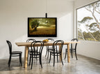 Lone Tree Desert Eagle landscape canvas print on the wall of a dining room