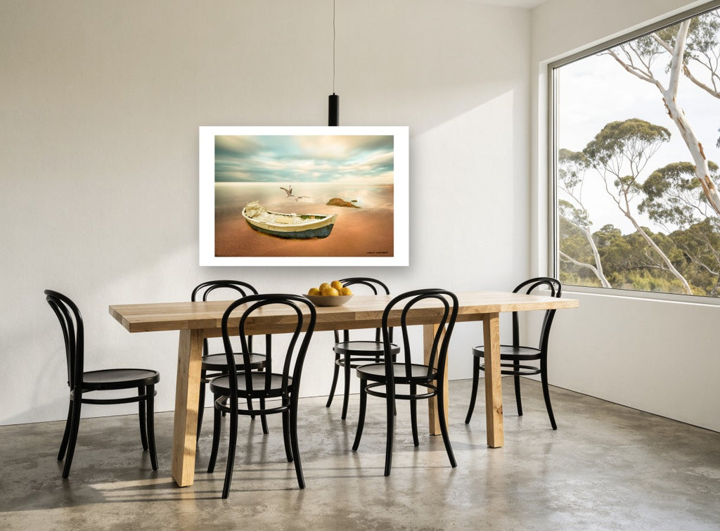 Dawn Boat and Gulls coastal canvas print on the wall of a dining room