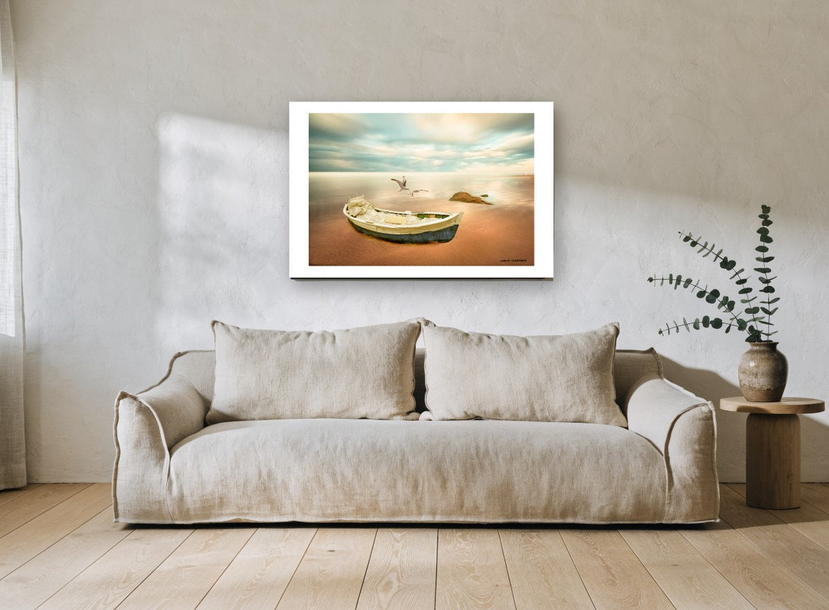 Dawn Boat and Gulls coastal canvas print on the wall of a living room
