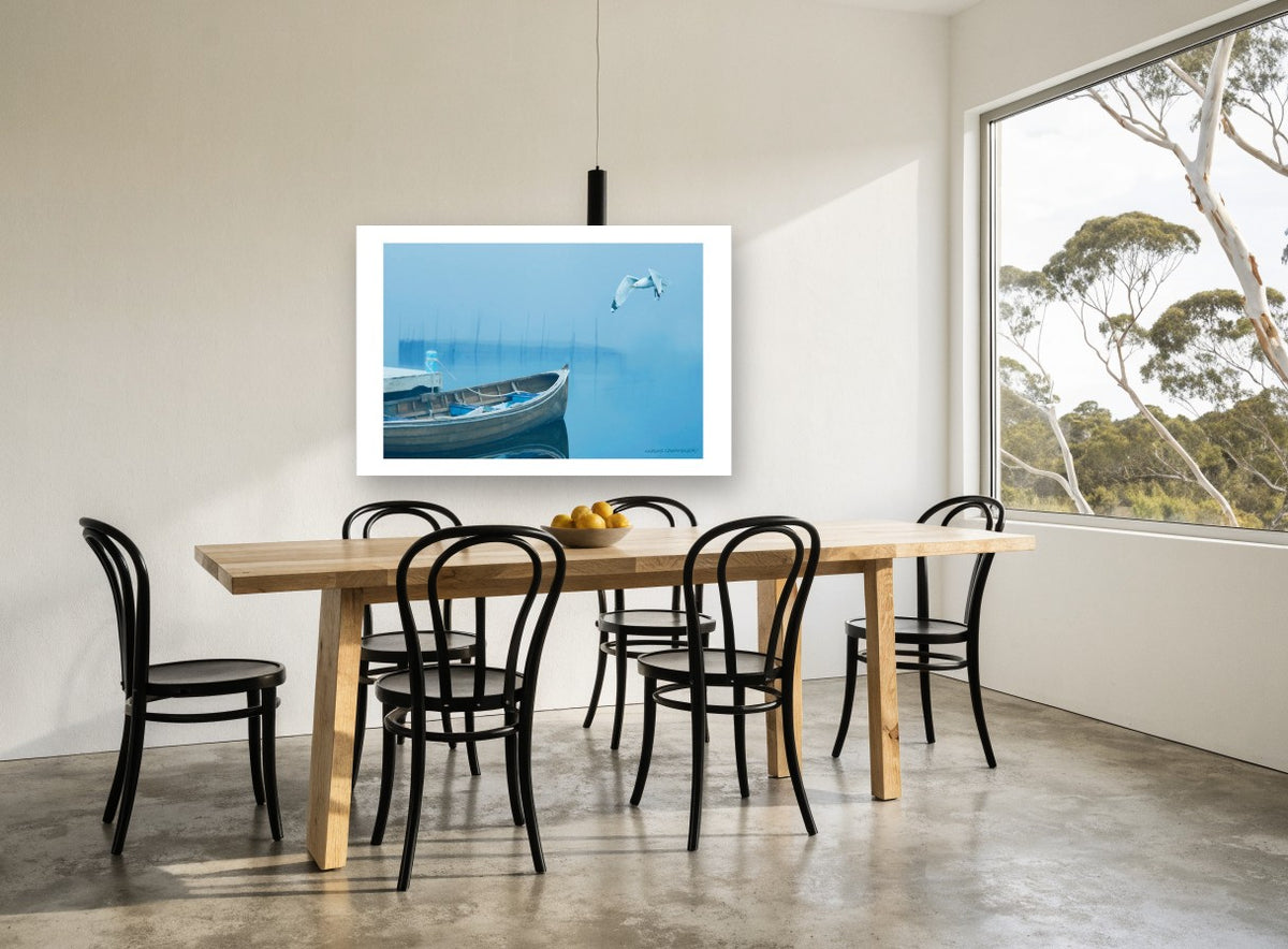 Gull Over Foggy Bay coastal canvas print on the wall of a dining room