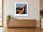 Timber Bow at Anchor coastal canvas print on the wall of a living room above a sideboard