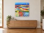 Patchwork Poppy Fields landscape canvas print on the wall of a living room above a sideboard