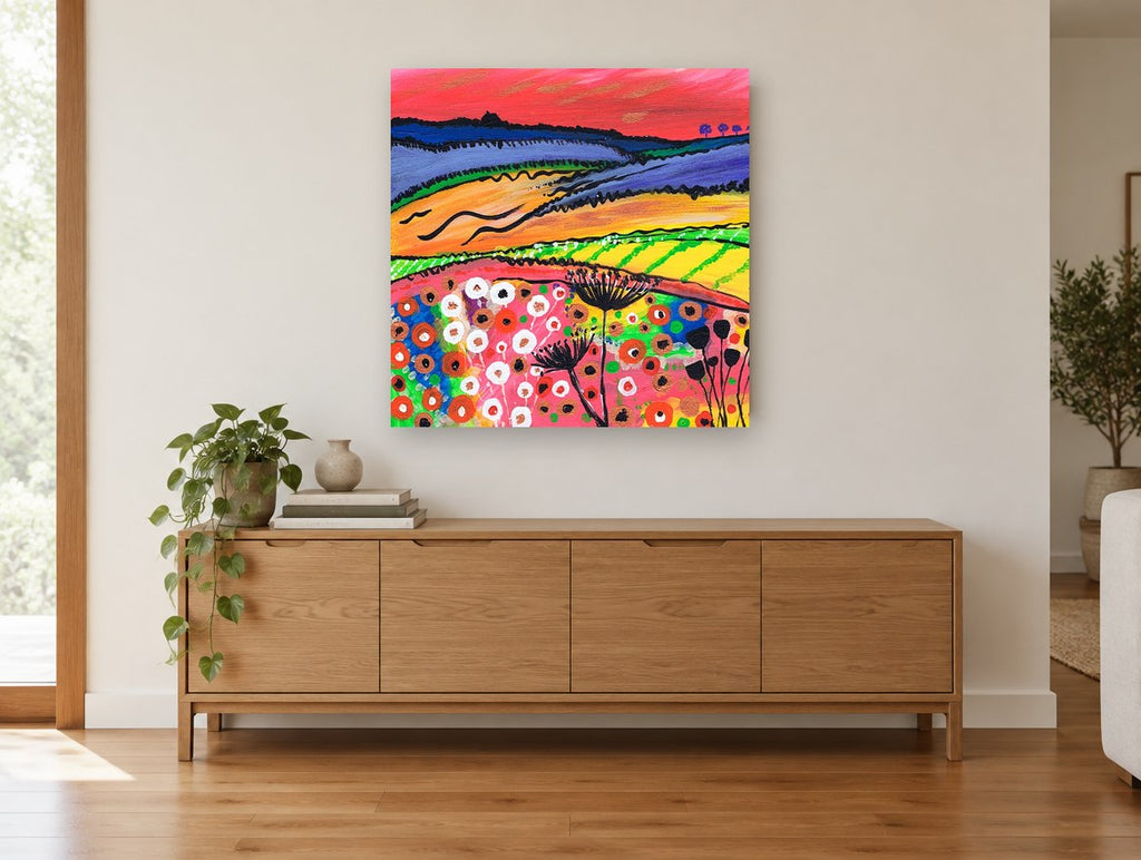 Crimson Sky Meadow landscape canvas print on the wall of a living room above a sideboard