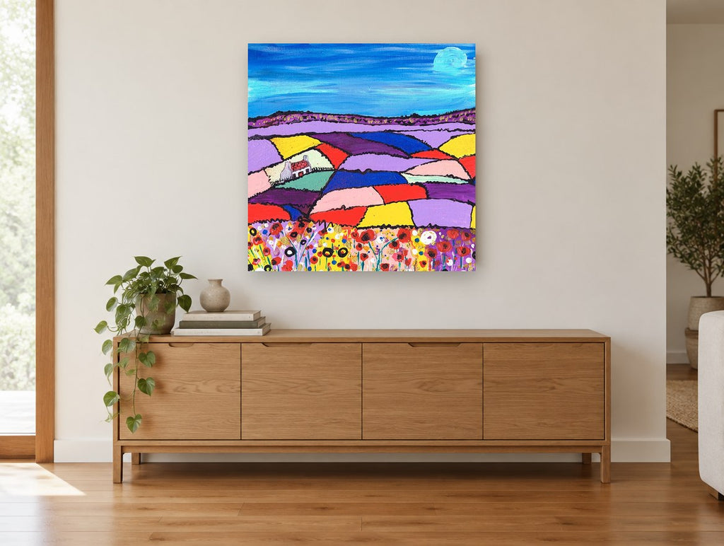 Patchwork Fields Cottage landscape canvas print on the wall of a living room above a sideboard